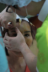 Portrait of patient having medical treatment by doctor in operating room