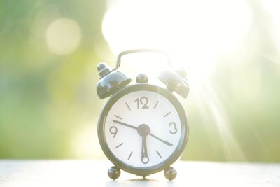 Close-up of clock on table