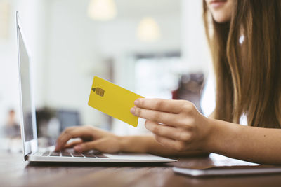 Young woman making online payment