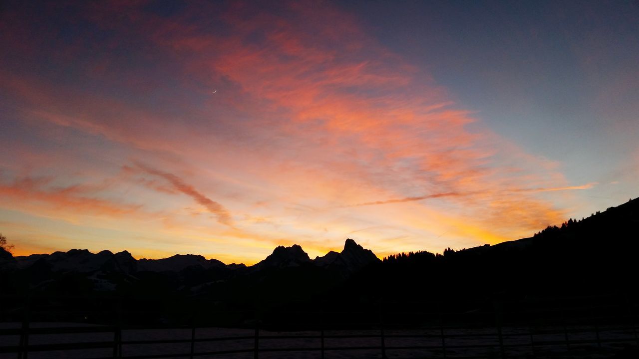 sunset, silhouette, scenics, sky, tranquil scene, beauty in nature, tranquility, orange color, mountain, landscape, idyllic, nature, cloud - sky, cloud, dramatic sky, mountain range, dark, majestic, moody sky, dusk