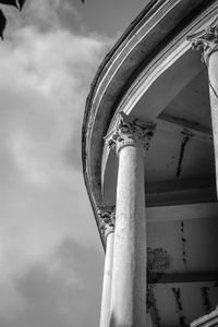 Low angle view of old pole against sky