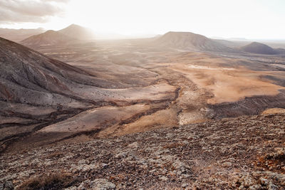 Scenic view of sunset in the mountains with the desert volcanic landscape, fuerteventura island
