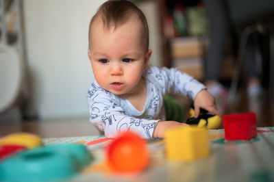 Portrait of cute little baby playing