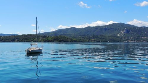 Scenic view of lake against blue sky