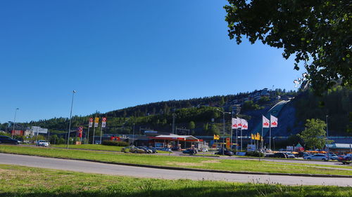 View of street against clear blue sky