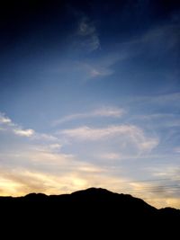 Silhouette mountains against sky during sunset