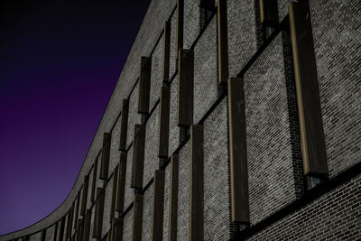 Low angle view of building against sky at dusk