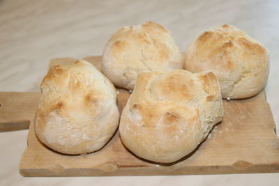 High angle view of bread on cutting board