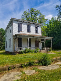 View of house against cloudy sky