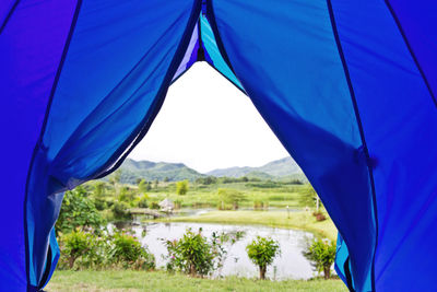 Close-up of tent against blue sky