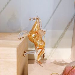 Close-up of horse statue against wall at home