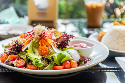 Salad with vegetable cherry tomato ,carrot ,red cabbage.concept for heathy food and home made meal.