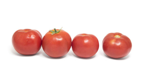 Close-up of red fruit on white background