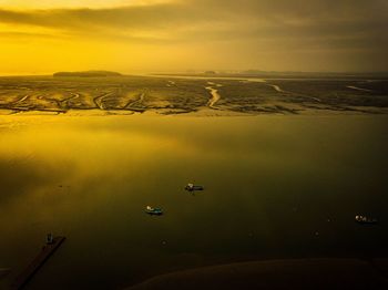 High angle view of sea against sky during sunset