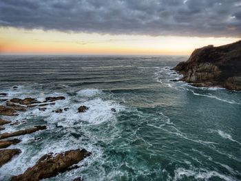 Scenic view of sea against sky during sunset