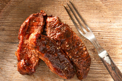 High angle view of meat on cutting board