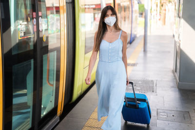 Woman standing in bus