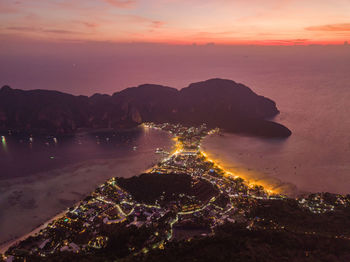 Aerial view of sea against sky during sunset