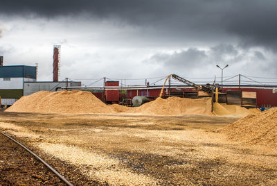 Construction site on field against sky