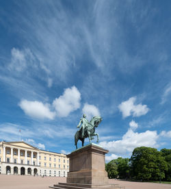 Low angle view of statue against sky