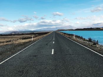 View of road against cloudy sky