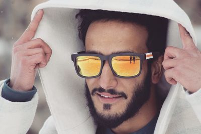 Close-up of young man wearing sunglasses