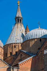 View of temple building against clear blue sky in padua