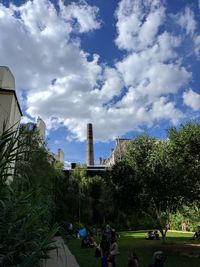 Trees and city against sky