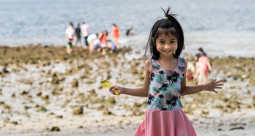 Portrait of a smiling girl on beach