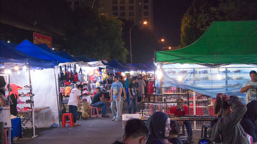 Crowd at market in city at night