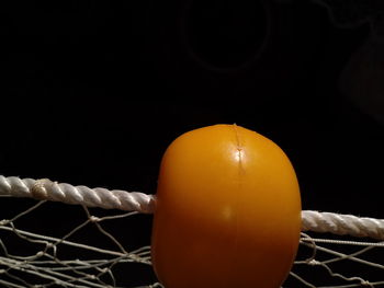 Close-up of illuminated lamp against black background