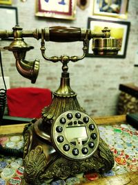 Close-up of clock on table