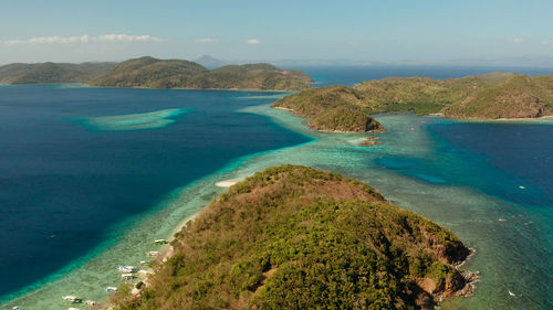 Tropical islands with blue lagoons, coral reef and sandy beach. palawan, philippines. 