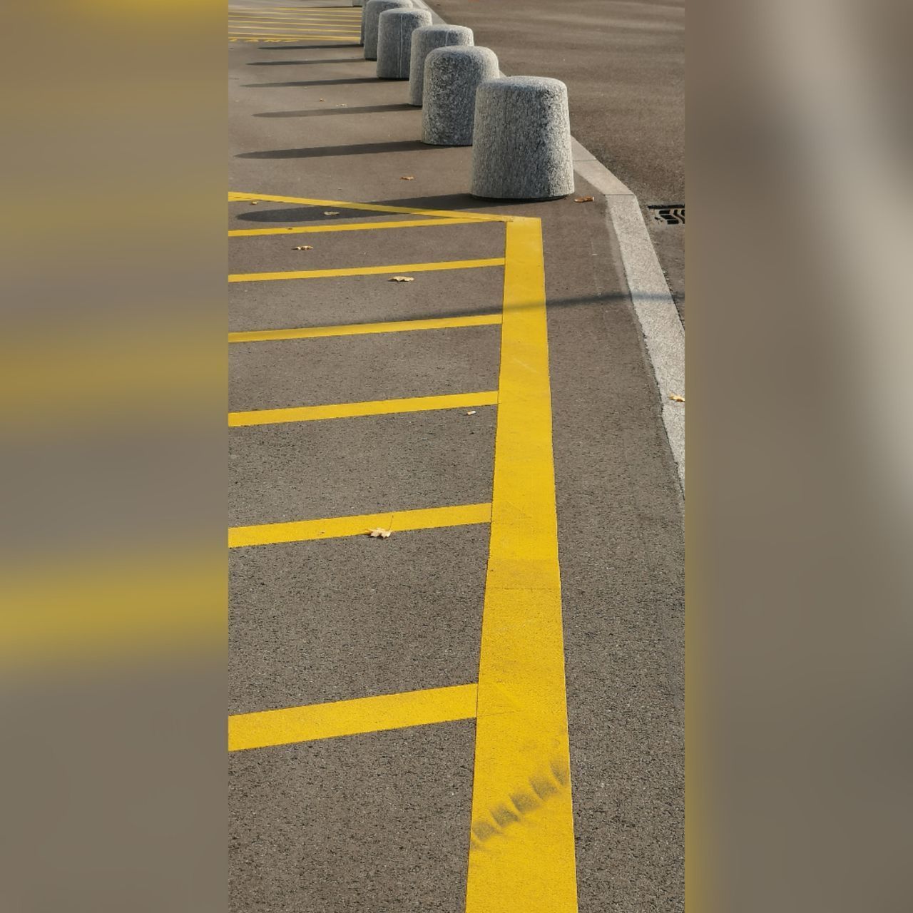 HIGH ANGLE VIEW OF YELLOW FLAG ON ROAD AT SHORE