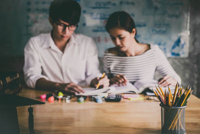 Young couple looking at camera