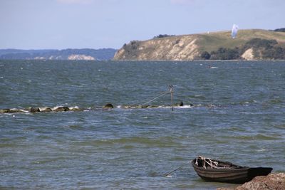 Boat in sea against sky