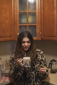 Portrait of a smiling young woman in winter