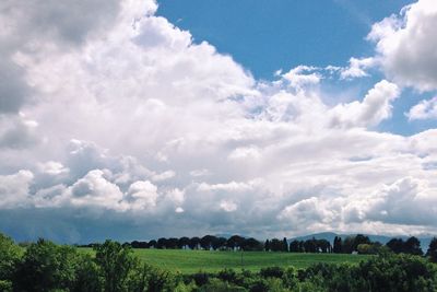 Scenic view of landscape against cloudy sky