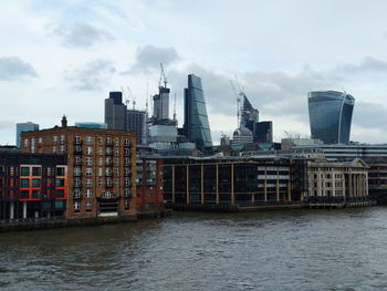 Modern buildings in city against sky