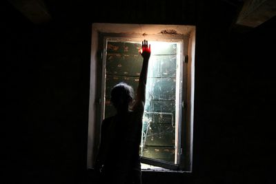 Close-up of woman in dark room