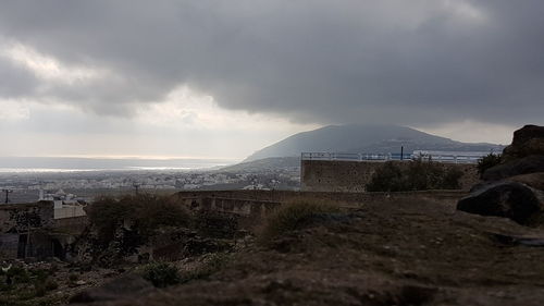 Scenic view of sea and buildings against sky