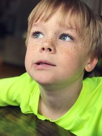 Close-up of boy looking up