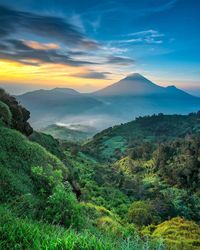 Scenic view of mountains against sky during sunset