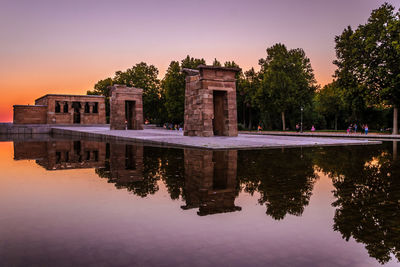 Reflection of buildings in calm lake