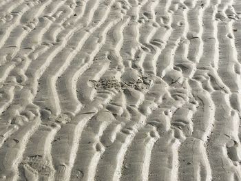 Close-up of tire on sand