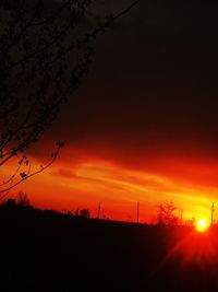 Scenic view of silhouette landscape against romantic sky at sunset