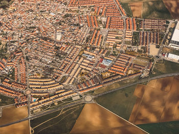 High angle view of river amidst buildings in city