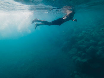 Man swimming in sea