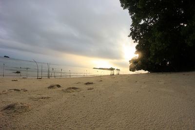 Scenic view of beach against sky during sunset