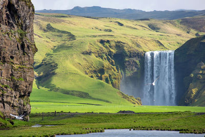 Scenic view of waterfall on mountain